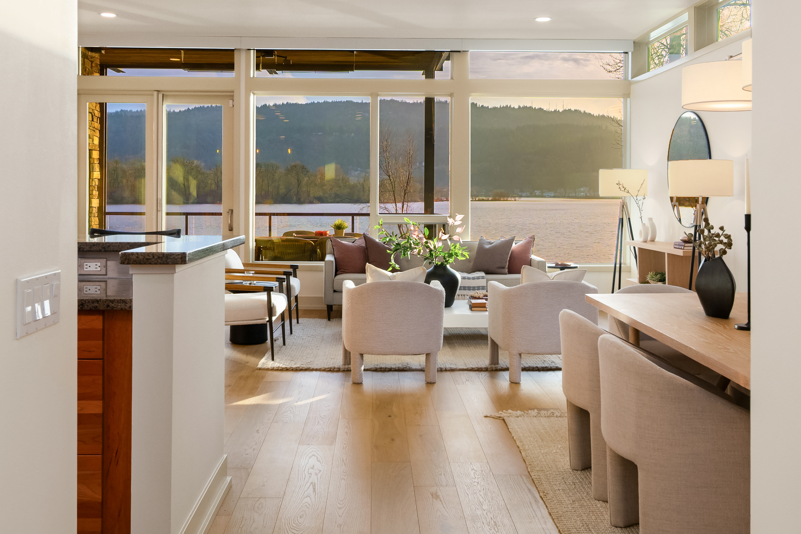 Open living and dining space with lake views