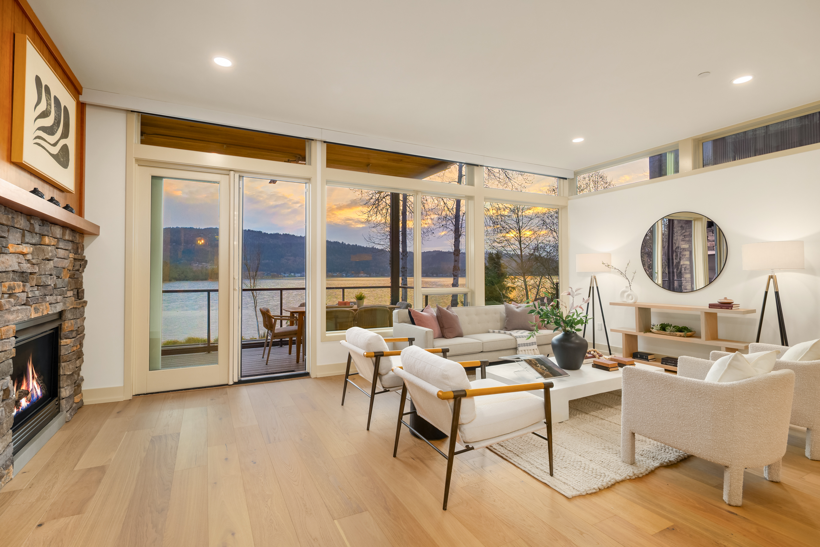 Living area with fireplace and panoramic lake views